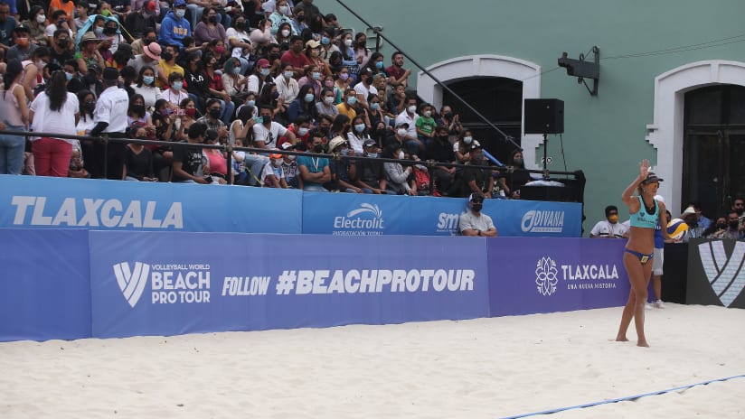 Fans cheer from the side court stands