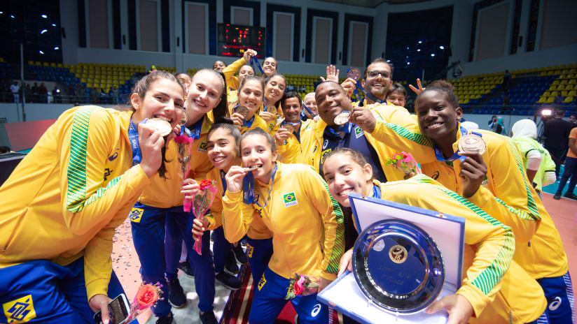 Brazil pose with their bronze medals on the podium of the 2019 FIVB Girls' U18 World Championship in Ismailia