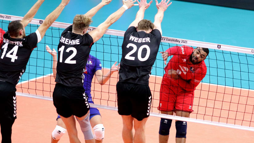 Earvin Ngapeth spikes through a three-men German block (source: cev.eu)