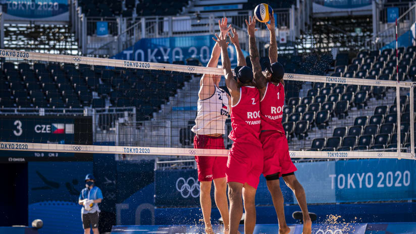 Not your everyday block on the beach! Krasilnikov and Stoyanovskiy raise a double block to stop Schweiner!