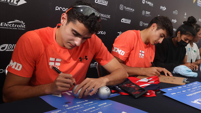 English players Javier and Joaquin Bello sign autographs for the fans
