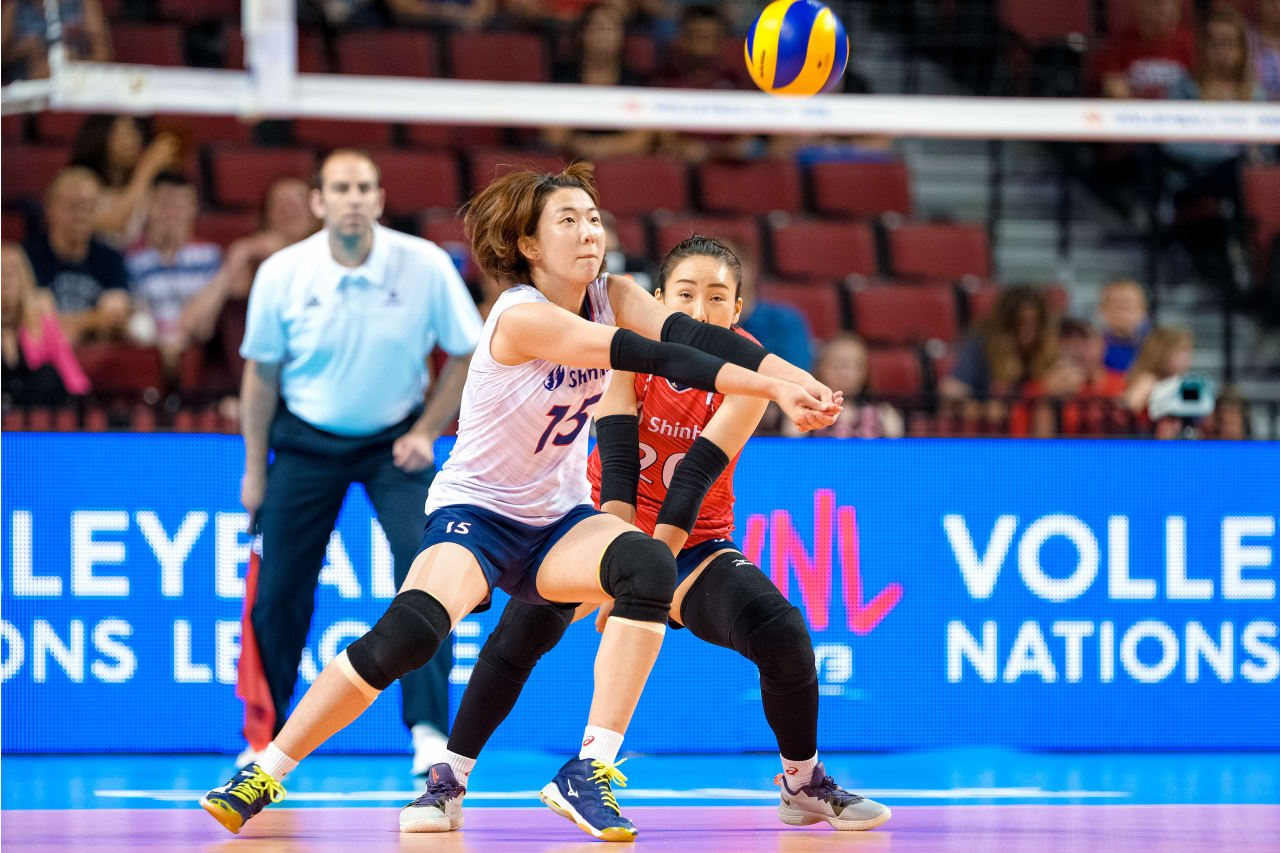 Kang Sohwi gets to the ball ahead of libero Oh Jiyoung at the 2019 FIVB Volleyball Nations League.