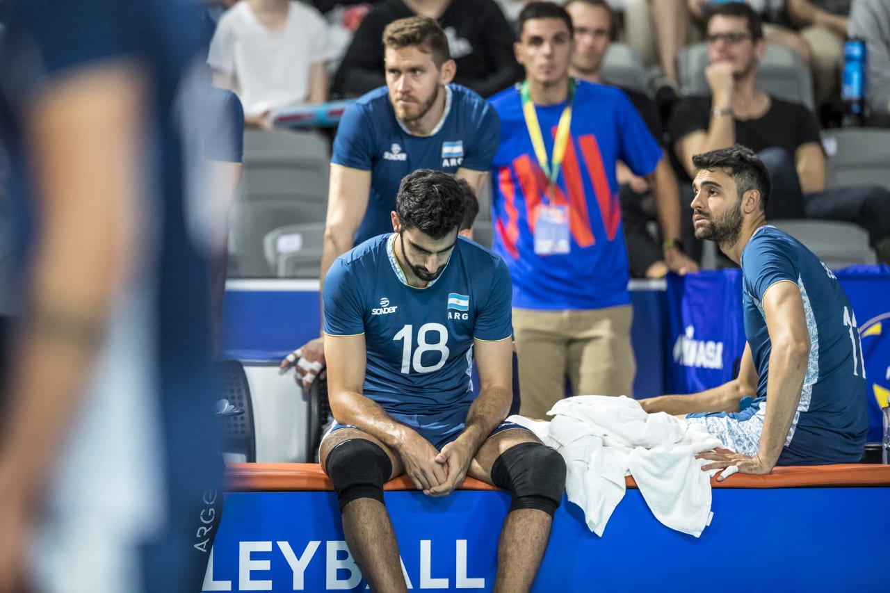 Martin Ramos and Sebastian Sole, spent and catching their breath during the 2019 FIVB Volleyball Nations League.