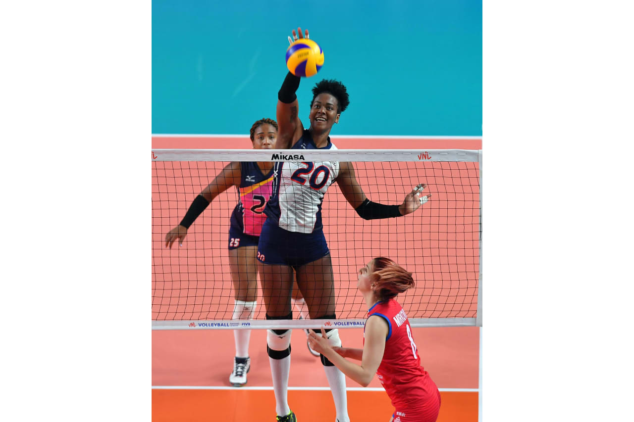 Brayelin Martinez strikes against Serbia at the 2019 FIVB Volleyball Nations League.