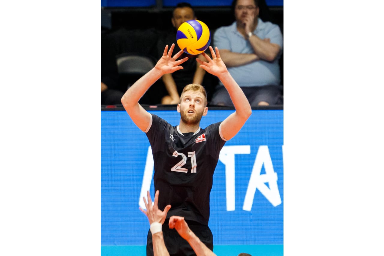 Brett Walsh sets the ball at the 2019 FIVB Volleyball Nations League.