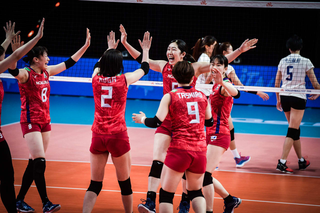 Erika Araki and Japan celebrate a point against Thailand