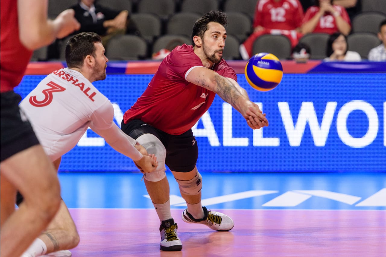 Stephen Maar gets the dig ahead of libero Steven Marshall at the 2019 FIVB Volleyball Nations League.