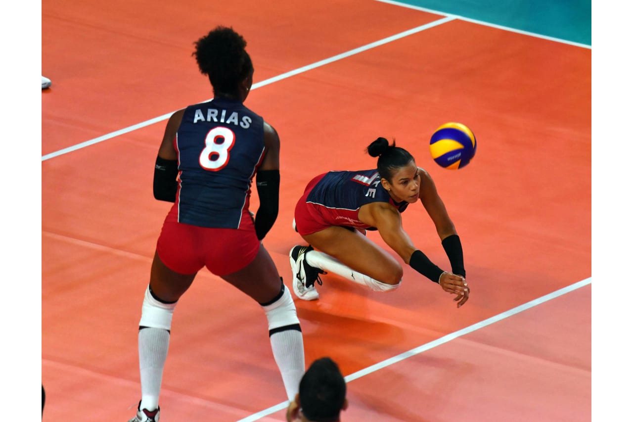 Niverka Marte gets the dig as Candida Arias follows the action during the 2019 FIVB Volleyball Nations League.