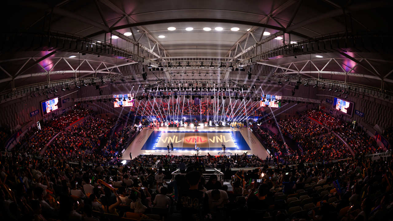 Enthusiastic home crowd at Beilun Gymnasium during Brazil vs. China VNL match.