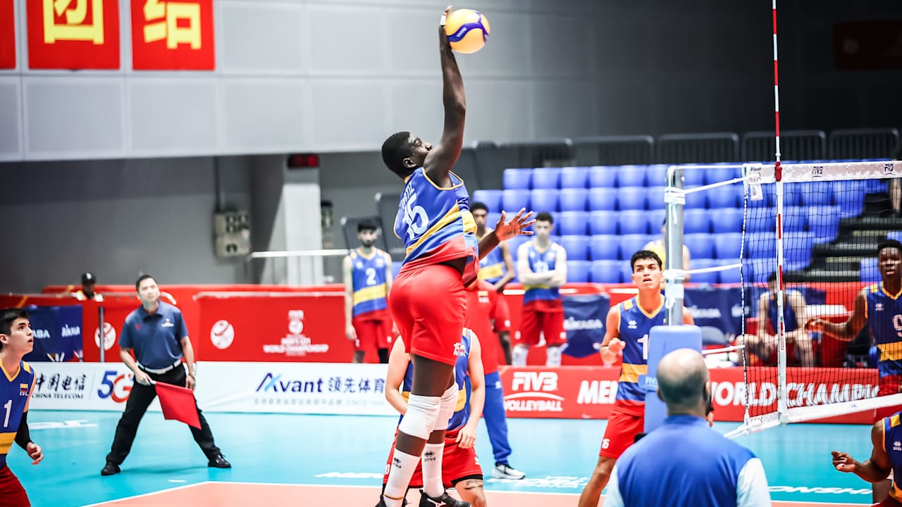 Maicol Ortiz soaring for a spike during a match
