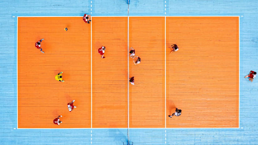 Top shot of teams on a volleyball court displaying different formations