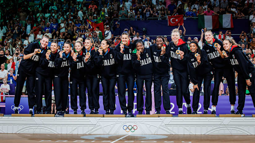 Italian players pose with their country's first-ever Olympic gold medals