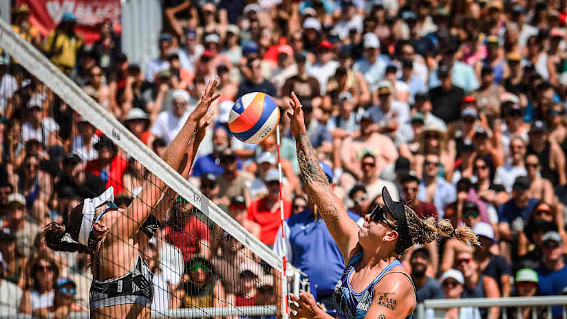 Rebecca of Brazil spikes against Zoe of Switzerland during a match
