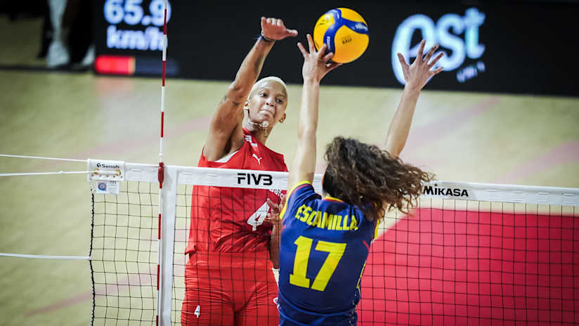Turkish and Spanish women`s volleyball players during a match.