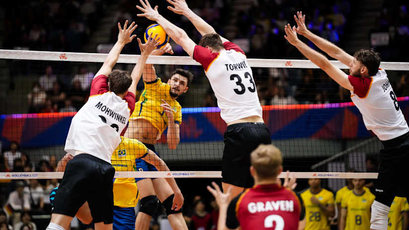 Brazil`s Arthur Bento Buczmiejuk spikes the ball against Germany.