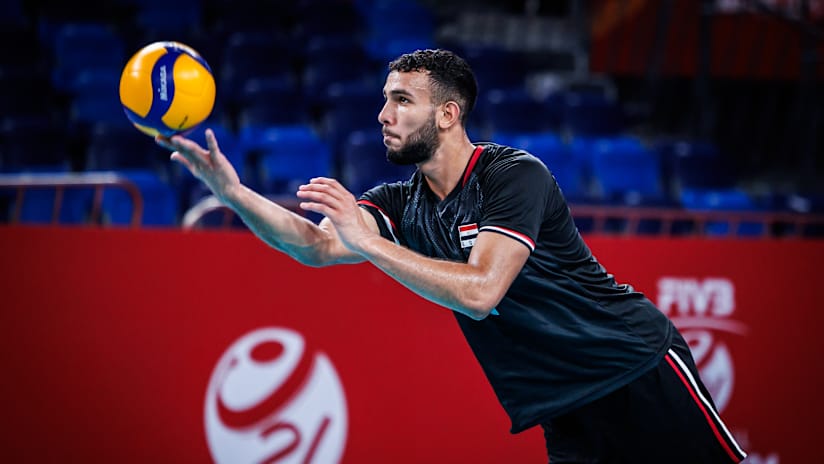 Houda serving during a match