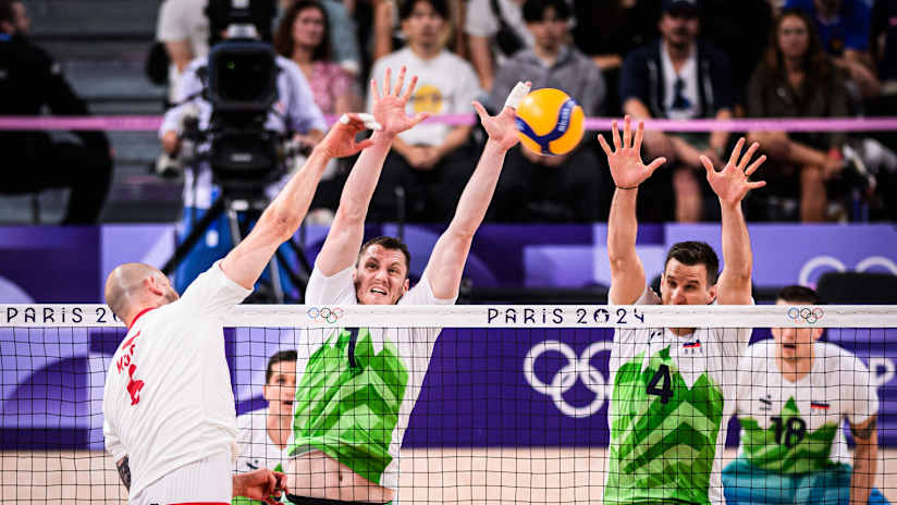 Captain Bartoz Kurek faces a pair of Slovenian blockers