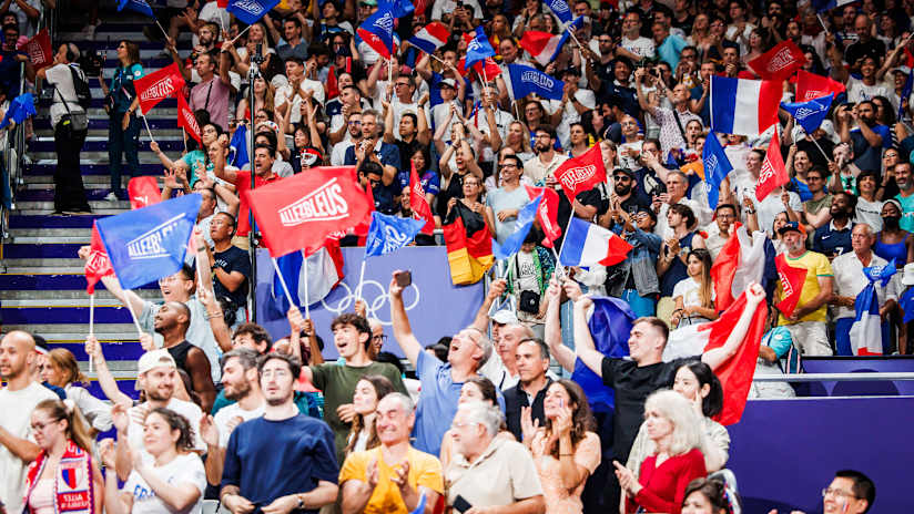 French fans wave their flags in support of the home team