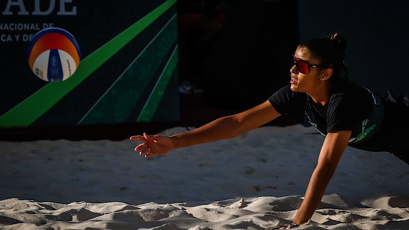 Marcela dives for the ball