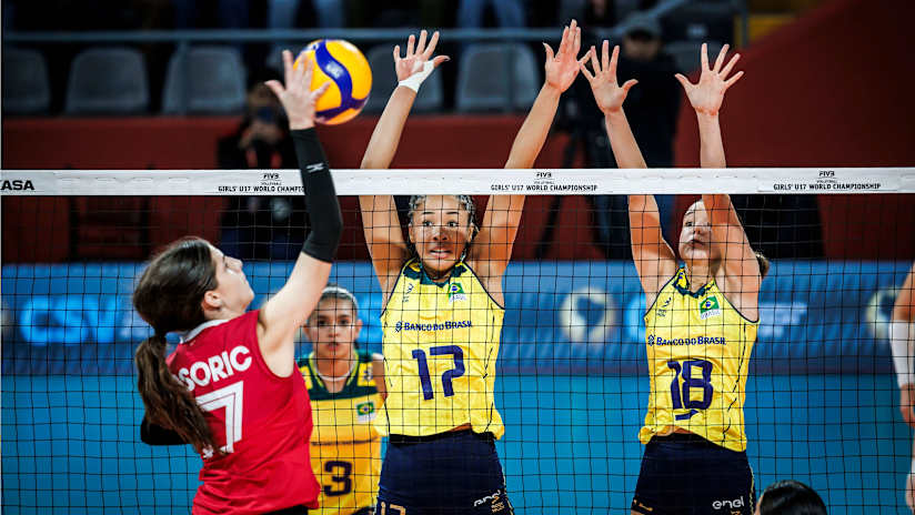 Brazil's Heloisa Andrade and Mariana Medeiros try to stop a Canadian attack