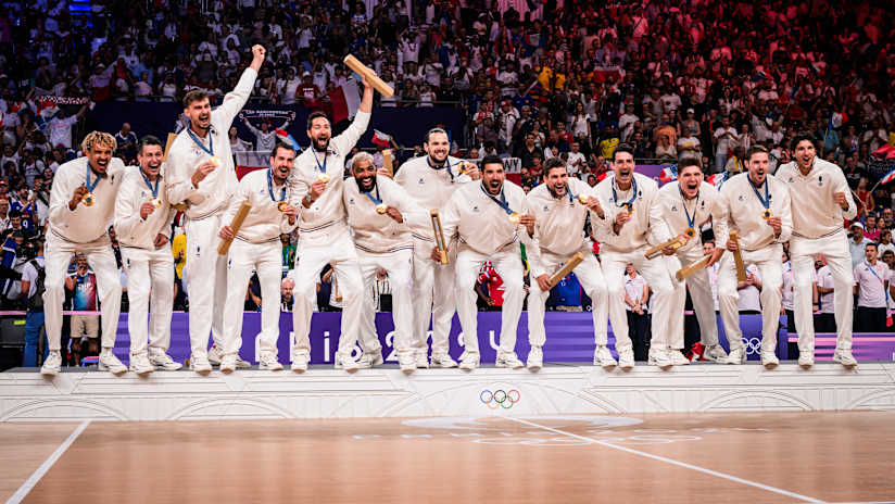 French players celebrate their second Olympic title in front of their home fans