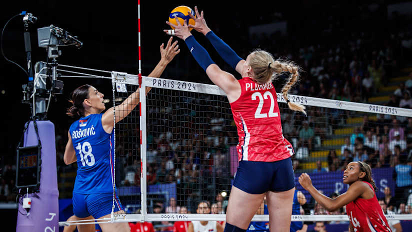 Serbia's Tijana Bošković and USA's Kathryn Plummer compete at the net