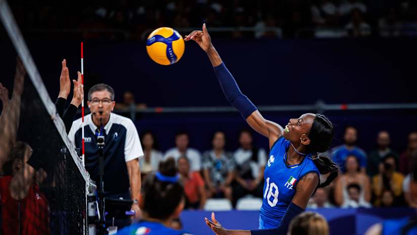 Paola Egonu goes up to swing against a Serbian blocker