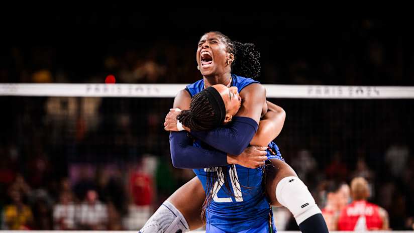 Italian outside hitters Myriam Sylla and Loveth Omoruyi hug after the game-winning point