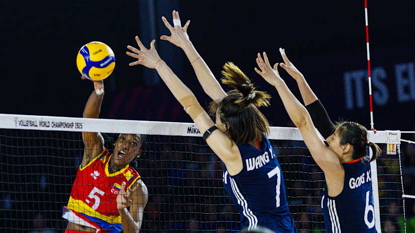 China`s Wang Yuanyuan and Gong Xiangyu blocking Colombia`s Ana Karina Olaya in a Women`s World Championship match.