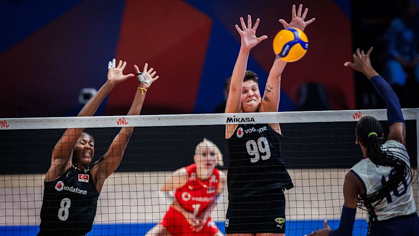 Turkish and Italian women`s volleyball teams in an intense match.