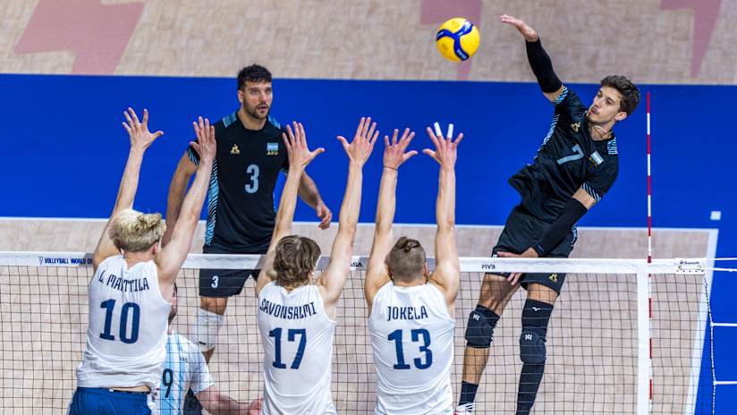 Argentine and Finnish volleyball players in action at the Men`s World Championship
