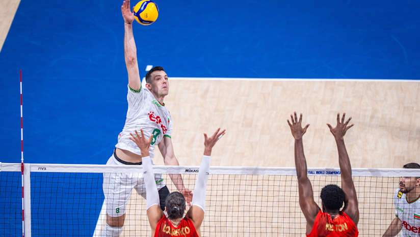 High-flying Asparuh Asparuhov of Bulgaria spikes above the Portuguese block