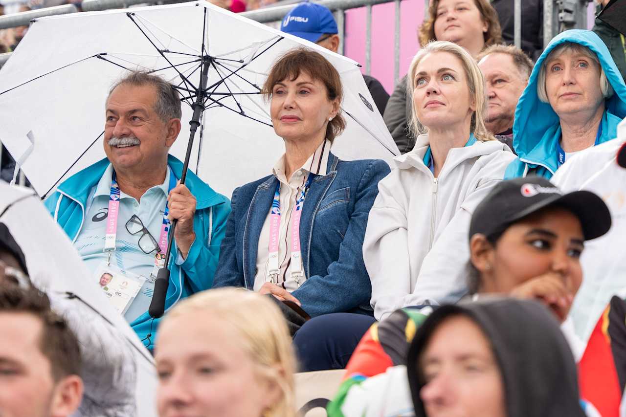 Brisbane 2032 Organising Committee President Andrew Liveris (middle) at Paris 2024 Beach Volleyball