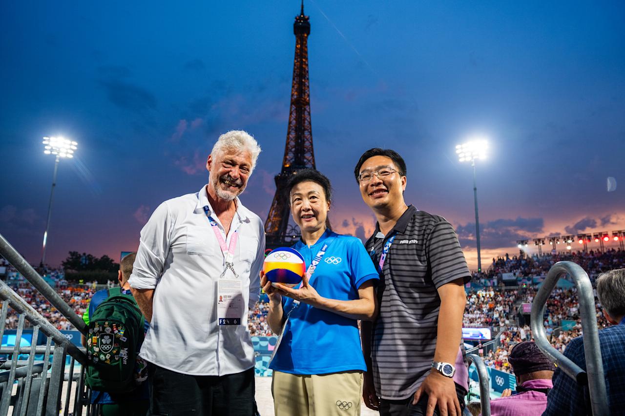 IOC Member Li Lingwei (middle) and and Marco Tullio Teixeira, FIVB Executive Vice-President at Paris 2024 Beach Volleyball