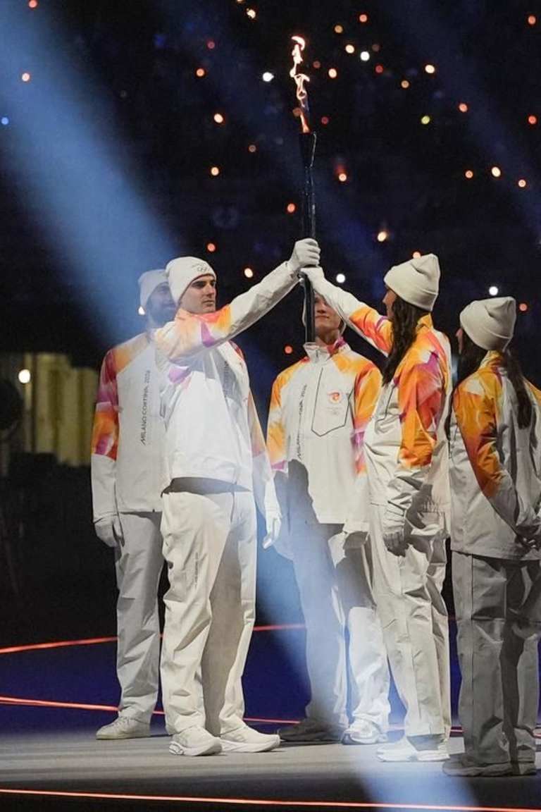Volleyball champions carry Olympic flame at Milan Cortina 2026 opening ceremony