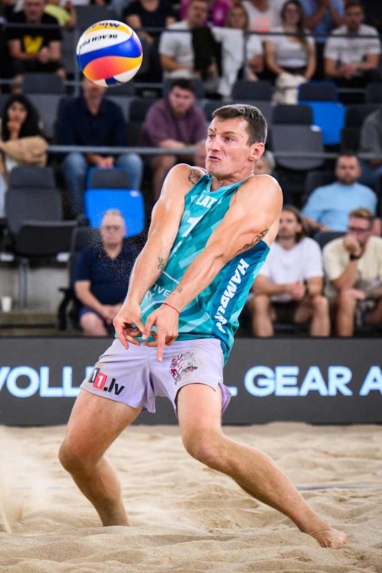 Plavins and Fokerots score big wins on their way to the semis